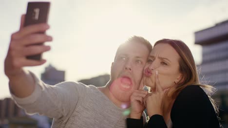 Cute-couple-making-funny-things-and-faces-for-selfie