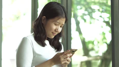 Asian-woman-using-smartphone