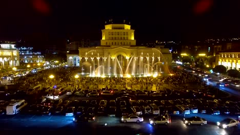 Hundreds-of-people-walking-around-Republic-Square-looking-at-beauty-of-fountains