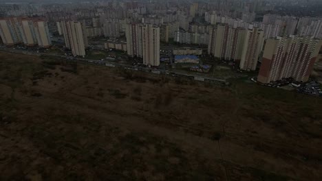 Aerial-drone-footage-of-gray-urban-city-outskirts-with-identical-houses