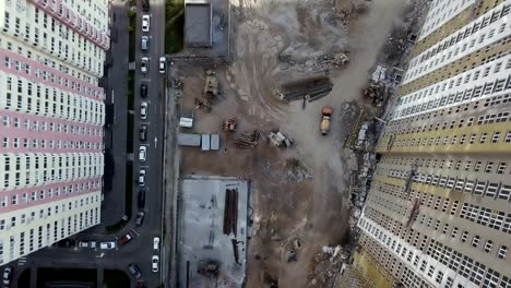 Aerial-view.-Urban-area-in-the-metropolis.-Construction-of-high-rise-residential-apartments-in-the-city.-View-of-the-building-site-from-above.-Sale-and-rental-of-residential-property