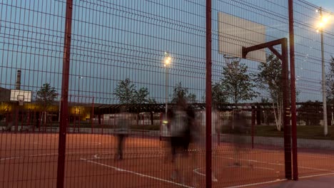 young-people-enthusiastically-play-street-basketball-from-morning-to-evening,-time-lapse