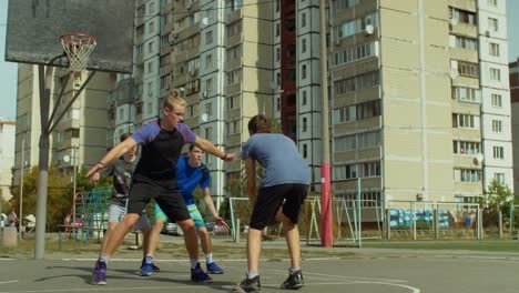Teenage-streetball-players-in-action-outdoors