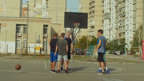 Teenage-basketball-players-shaking-hands-after-match