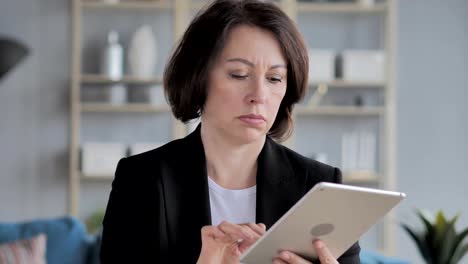 Senior-Old-Businesswoman-Using-Tablet-for-Browsing-Internet