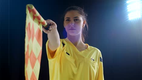 Assistant-female-referee-moving-along-the-sideline-during-a-soccer-match