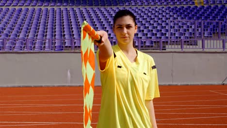 Assistant-female-referee-moving-along-the-sideline-during-a-soccer-match