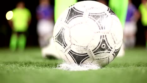 Soccer-ball-placed-on-penalty-spot-of-green-field