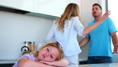 Parents-arguing-behind-their-sad-daughter