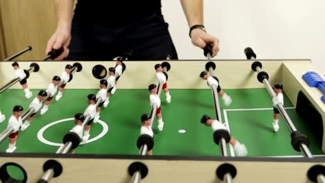 Men-playing-table-soccer.