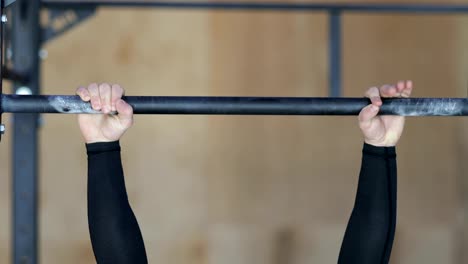 Male-Hands-Holding-Bar,-Man-Doing-Pulling-Exercise-During-Workout-Training-At-Gym