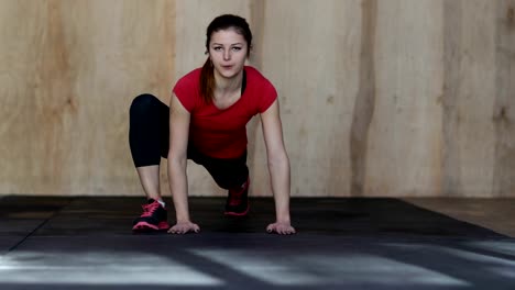 Young-Woman-Doing-Push-Ups-Exercise-During-Workout-Training-At-Gym