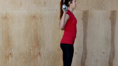 Young-Woman-Exercising-Doing-Weighted-Squats-During-Workout-Training-At-Gym