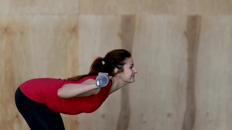 Young-Woman-Exercising-Doing-Weighted-Squats-During-Workout-Training-At-Gym