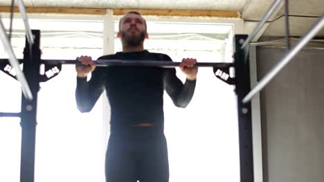 Man-Hanging-On-Bar,-Guy-Doing-Pulling-Up-Exercise-During-Workout-Training-At-Gym