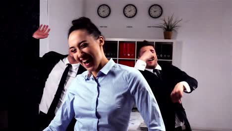 happy-colleagues-dancing-in-office-room