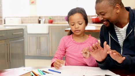 Father-helping-her-daughter-in-her-studies-4k