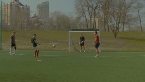 Soccer-player-shooting-on-goal-and-hits-cross-bar