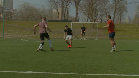 Young-soccer-player-scoring-goal-during-match