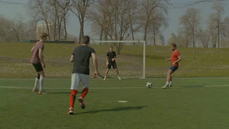 Young-soccer-player-celebrating-goal-on-the-field