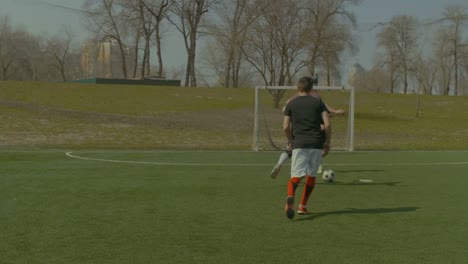 Football-goalkeeper-saving-goal-during-match