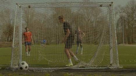 Young-goalkeeper-failing-to-save-goal-after-shot