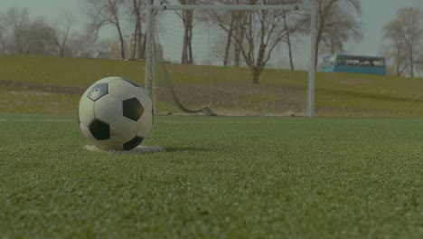 Soccer-player-executing-penalty-kick-during-training