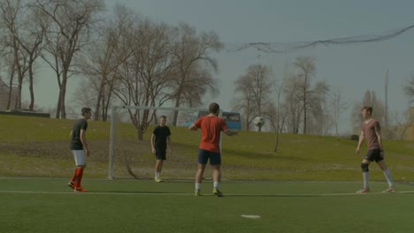 Soccer-player-executing-bicycle-kick-during-game