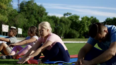 Family-working-out-together-on-stadium