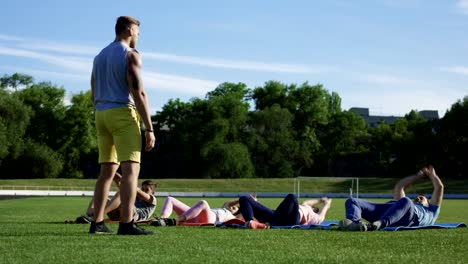 Family-working-out-together-on-stadium