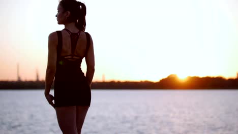 Beautiful-Girl-Trains-Her-Back-Before-Running-Near-The-River