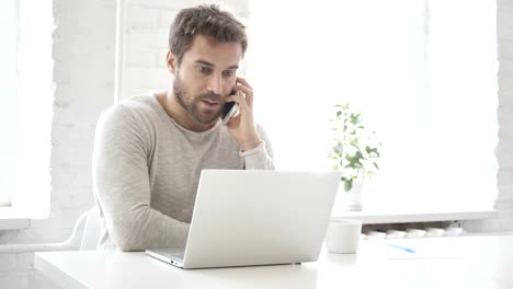 Businessman-Talking-on-Phone,-Discussing-Work