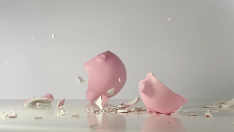 SLOW:-Pink-pig-money-box-falls-on-a-table-and-breaks-on-a-pieces