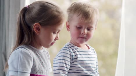 Little-Siblings-Playing-on-Tablet