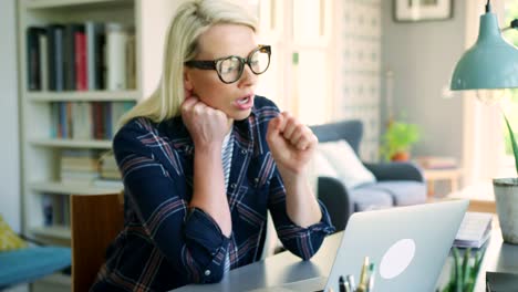 Attractive-Blond-Businesswoman-Feeling-Tired-At-Home-Office