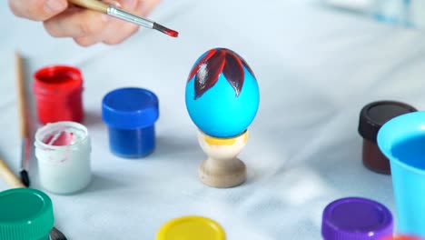 Woman-Hand-Painting-Easter-Eggs-with-the-Brush