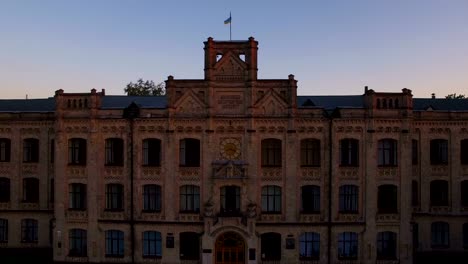 Old-university-on-the-background-of-the-city-at-sunset-aerial