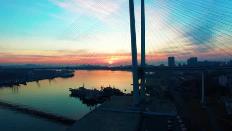 Aerial-view-of-Golden-horn-Bay-and-Golden-bridge-at-sunset.-Vladivostok,-Russia