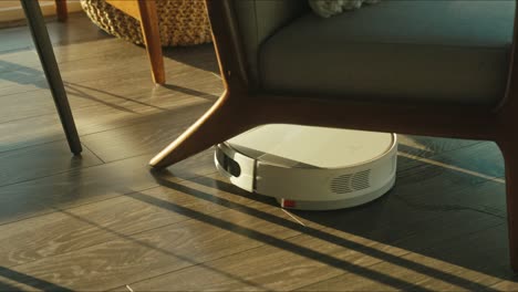 Close-up-of-the-robotic-vacuum-cleaner-riding-around-and-cleaning-up-apartments