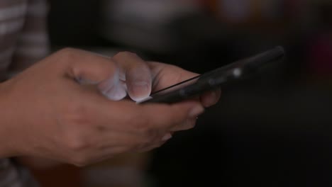 Close-up-woman-hands-texting-message-on-mobile-smart-phone-for-communication.