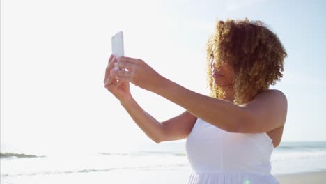 Plus-size-African-American-female-walking-by-ocean