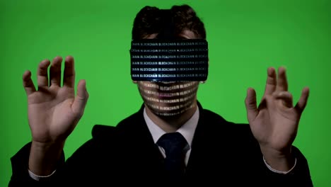 Futuristic-vr-technology-with-blockchain-hologram-code-used-by-a-businessman-who-types-continuously-on-a-green-screen-background