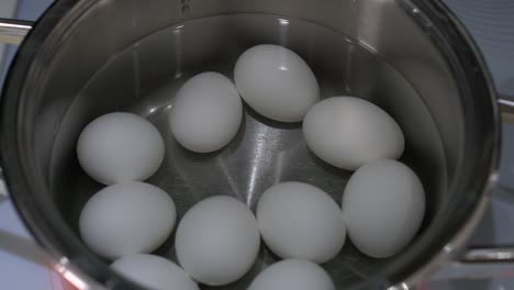 eggs-are-cooked-in-a-saucepan-close-up,-top-view