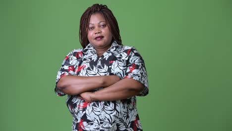 Overweight-beautiful-African-woman-against-green-background