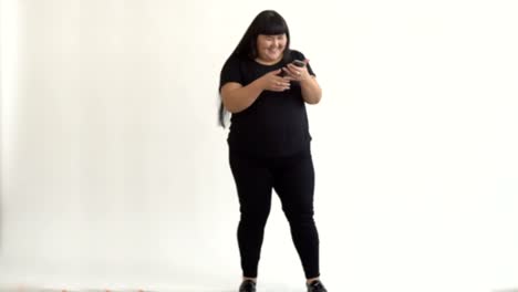 authentic-Asian-girl-dancing-and-enjoying-life-on-white-background.-Life-outside-of-the-stereotypes-of-today's-youth.-Concept-idea