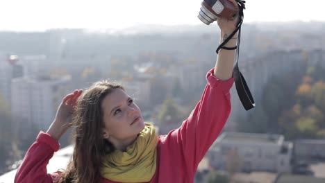 Attractive-woman-taking-selfie-outside