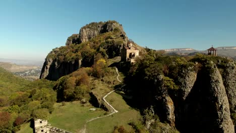 4K-UHD-Aerial-view-of-a-mountain-monastery-standing-on-a-cliff