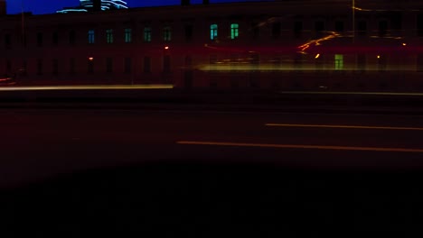 Time-lapse-traffic-of-cars-in-the-city-street-at-night.-Saint-Petersburg,-Russia.-4K