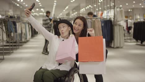 Woman-in-Wheelchair-Taking-Selfie-with-Friend-after-Shopping