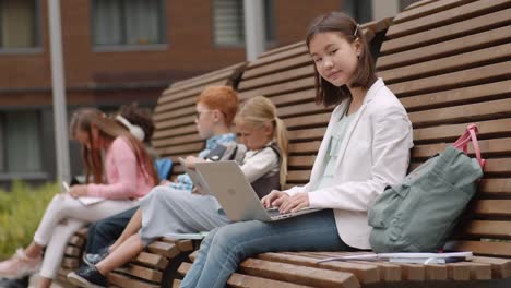 Portrait-of-Asian-Girl-Using-PC-during-Break